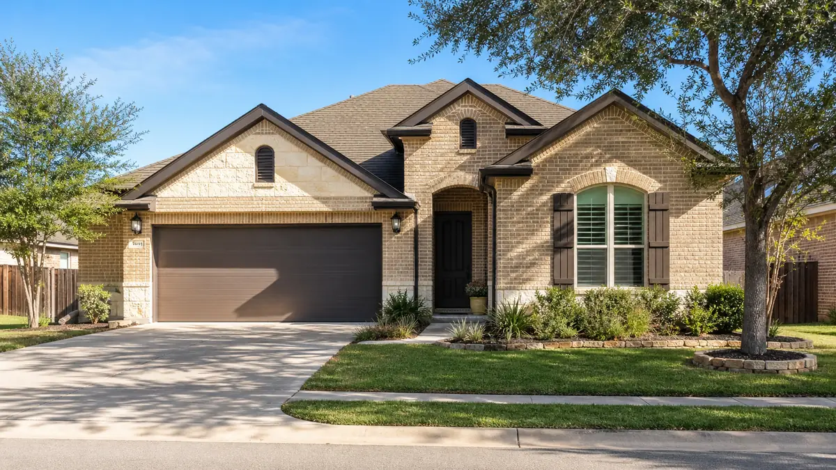 a tidy suburban single-family home on a calm South Texas street in warm daylight