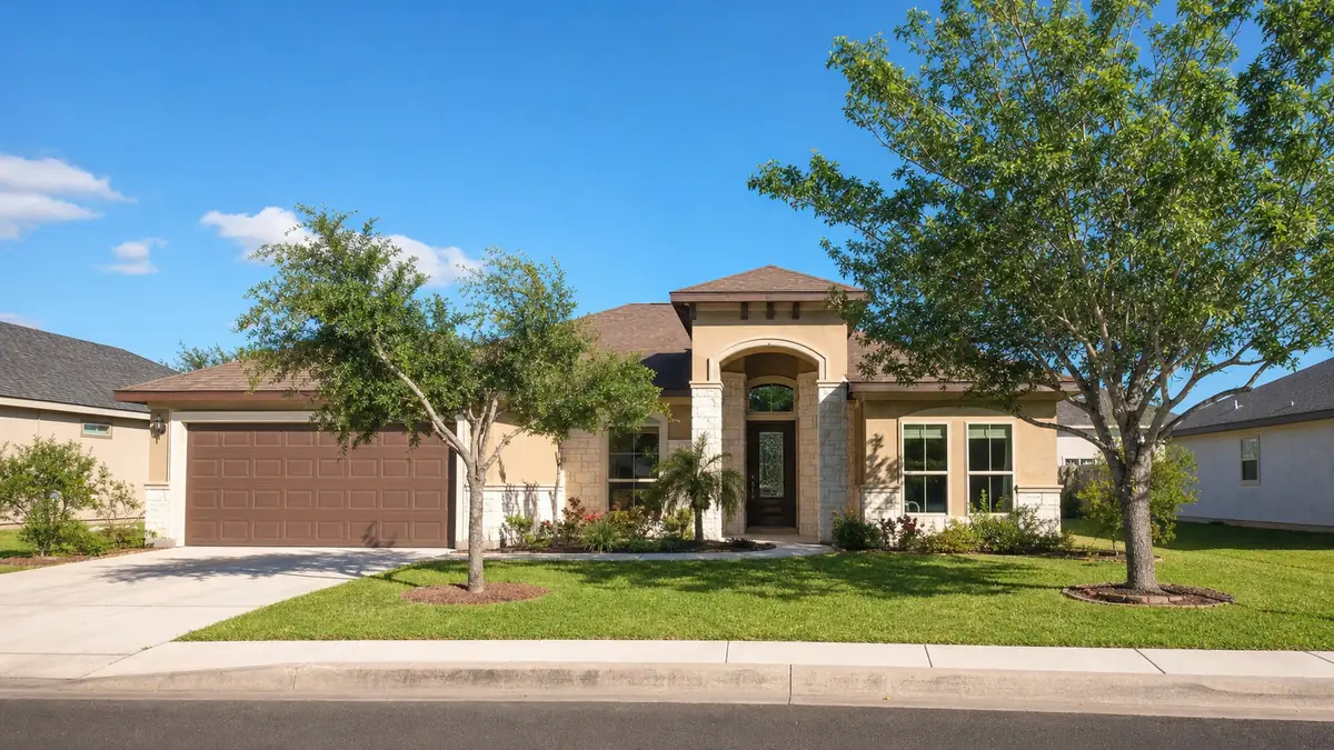 A neat single-family home with a tidy yard on a sunny Cameron County street.